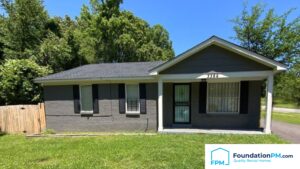 Memphis property manager reviewing rental portfolio and saving money