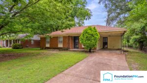 Property owner reviewing maintenance updates with Memphis property manager